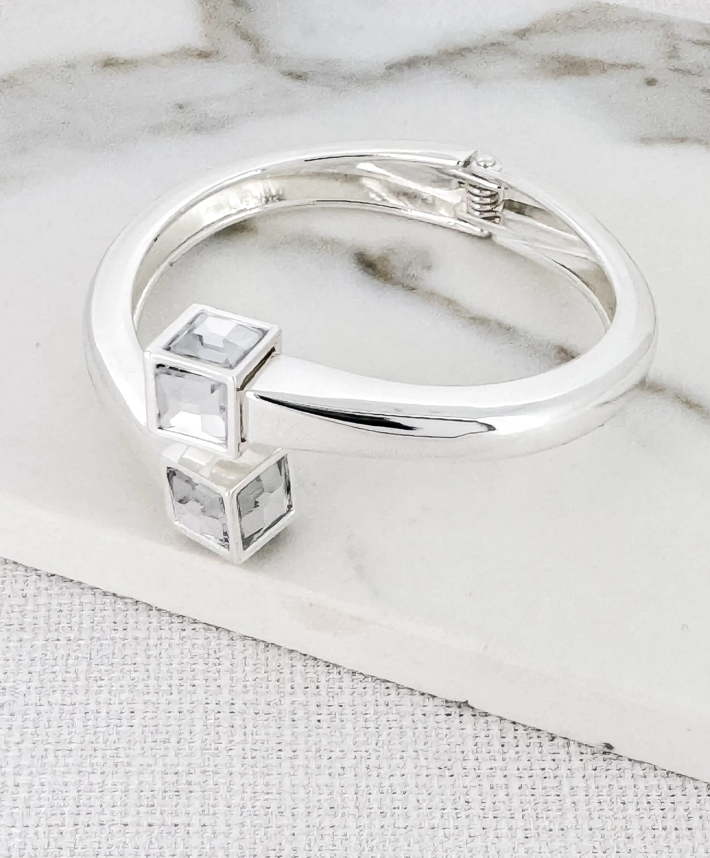 Envy silver hinged bangle with crystal cube