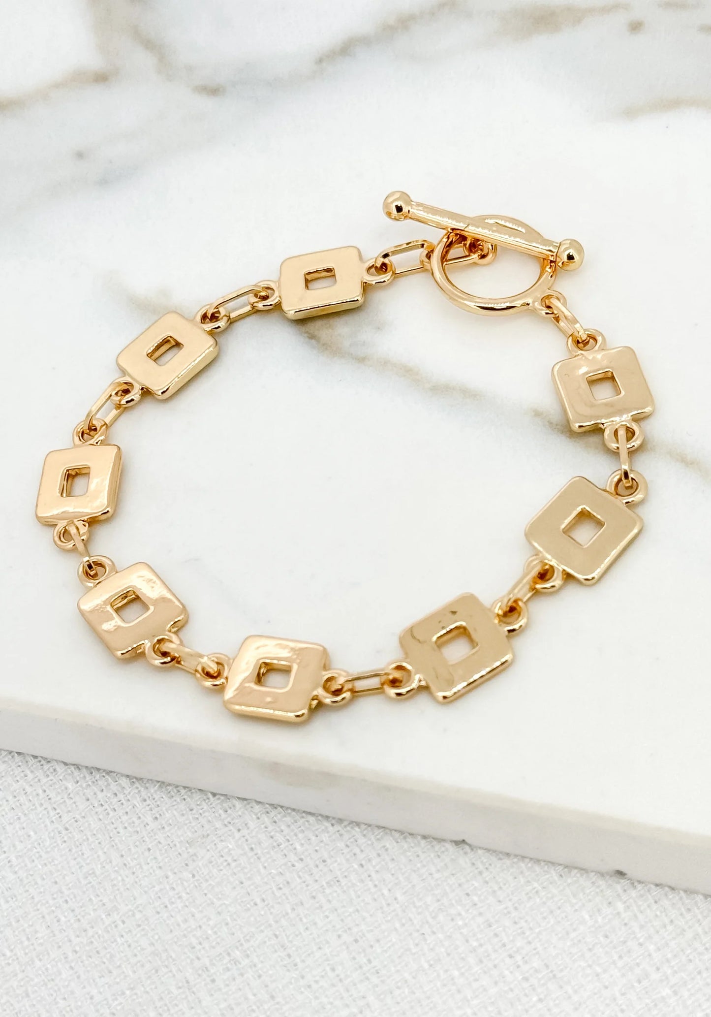 Envy gold T-bar bracelet with square links