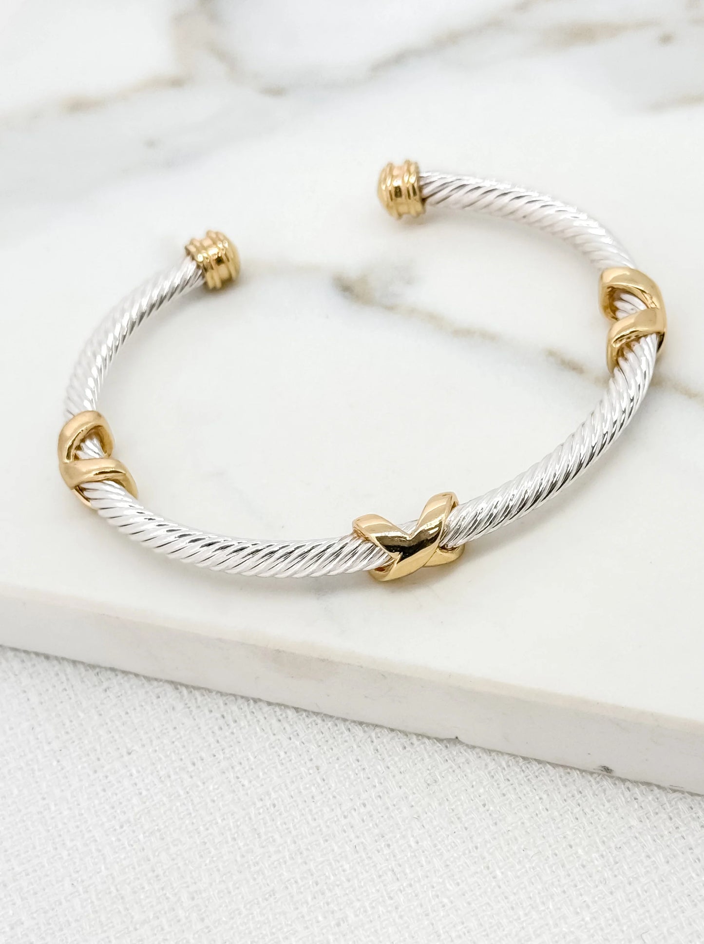 Envy textured silver bangle with gold cross detail