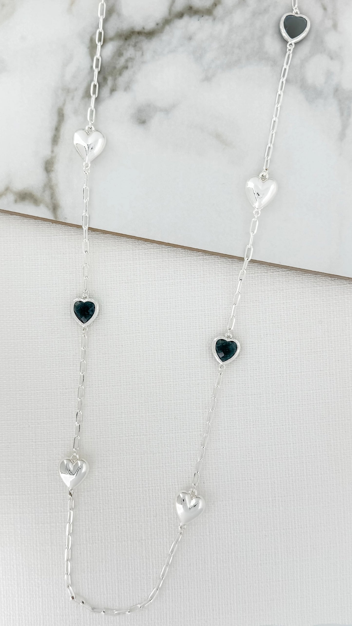 Envy silver and faceted grey glass hearts necklace