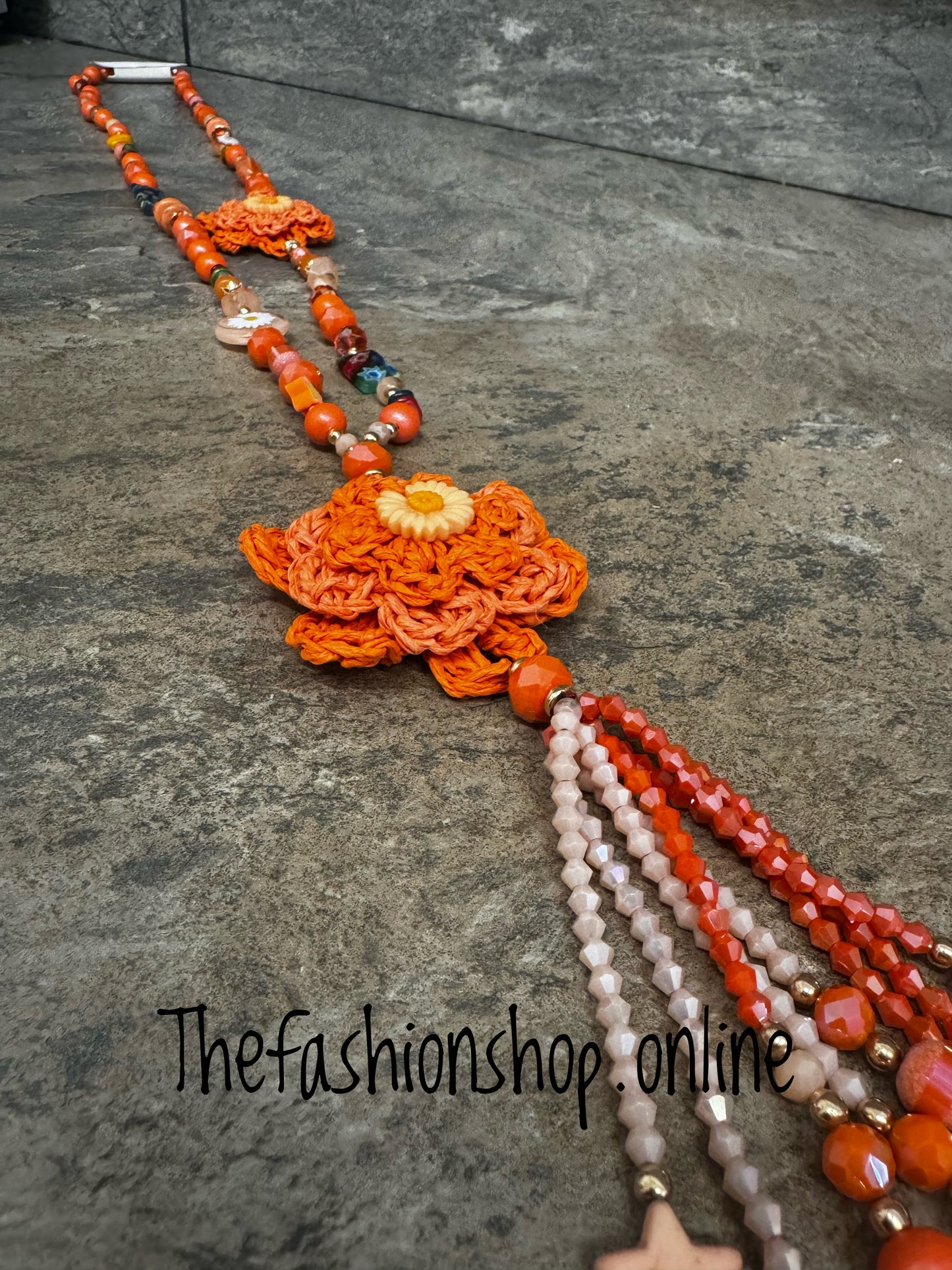 Orange crochet daisy and bead necklace