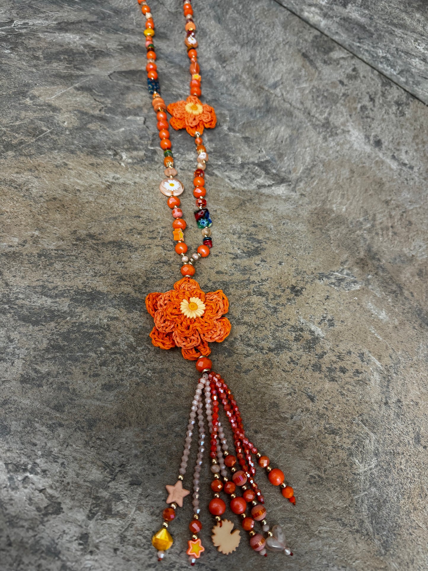 Orange crochet daisy and bead necklace