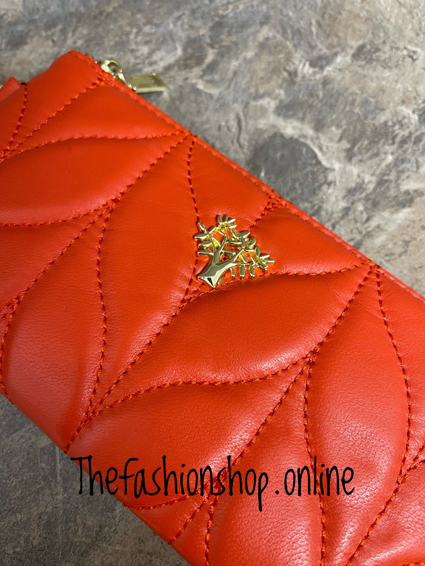 Orange leather quilted clutch