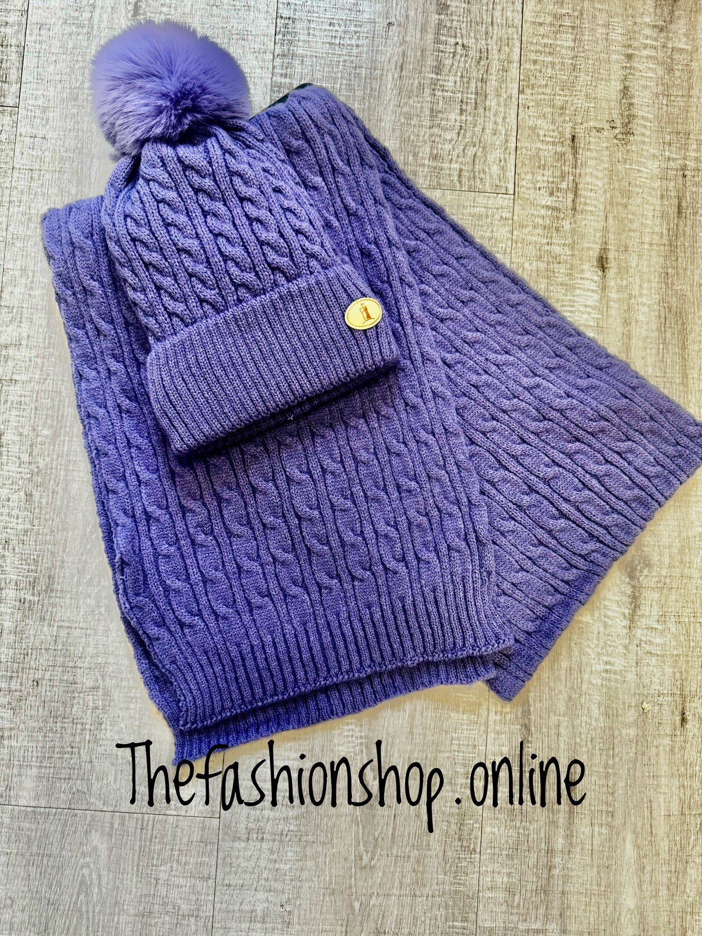 Huddy's purple cable knit hat and scarf set