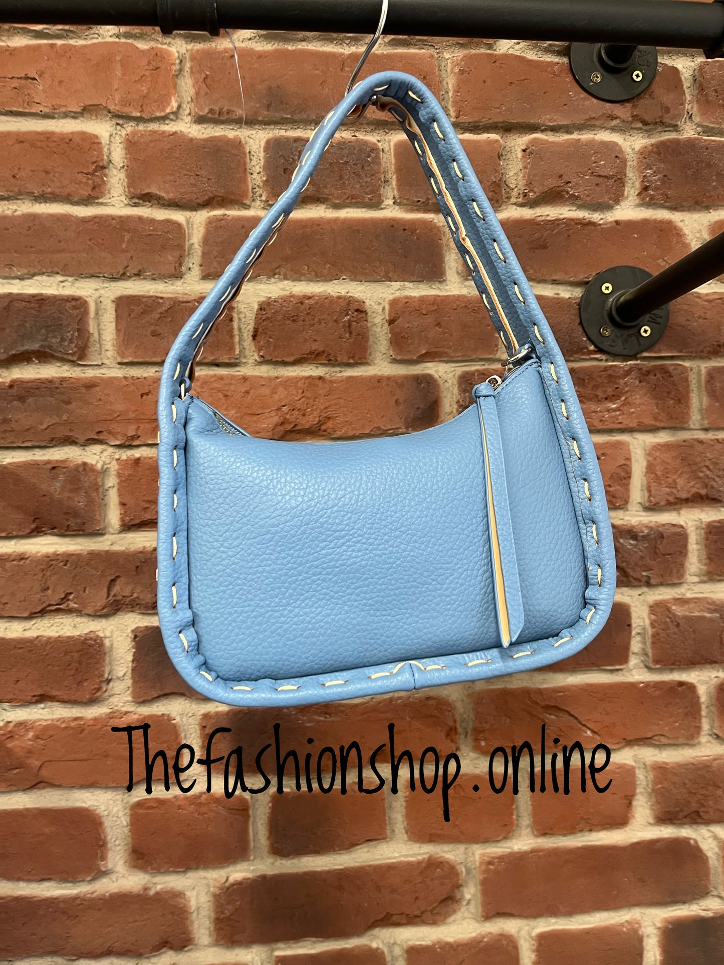 Small blue bag with stitch detail