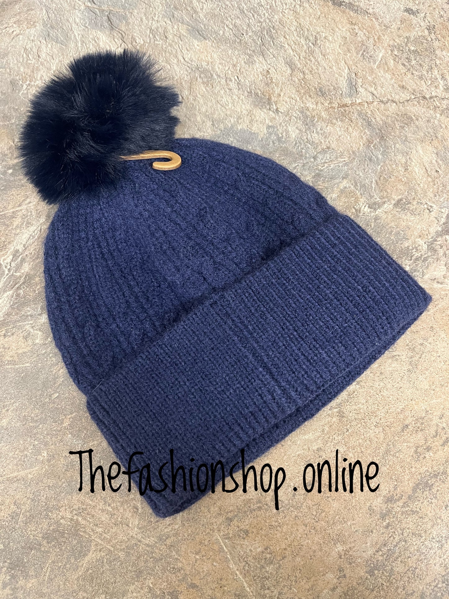 Navy blue fine cable knit pompom hat