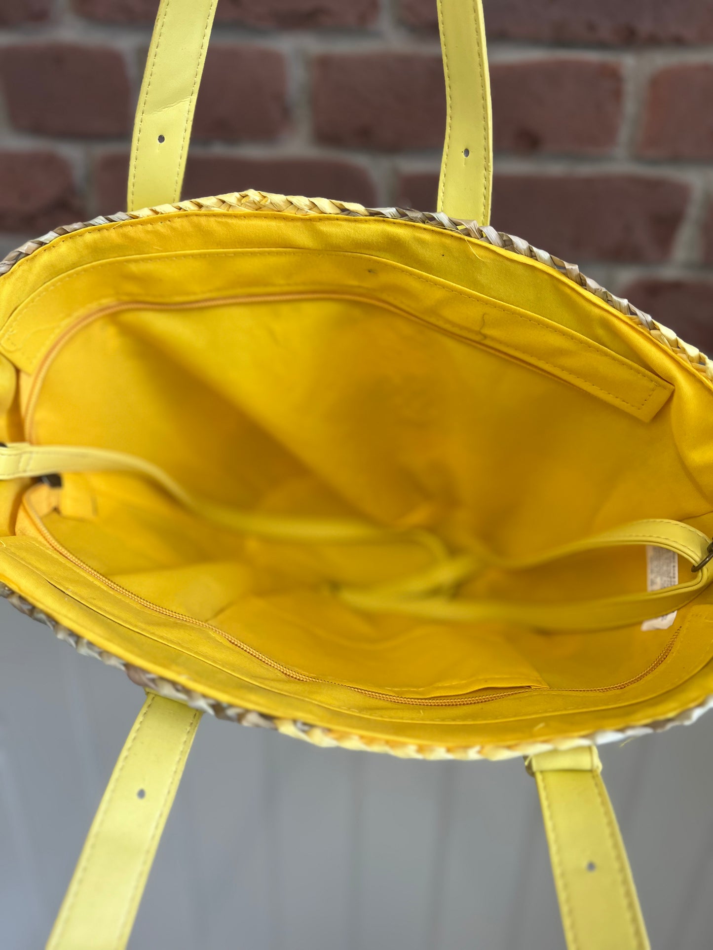 Straw shopper with yellow handles